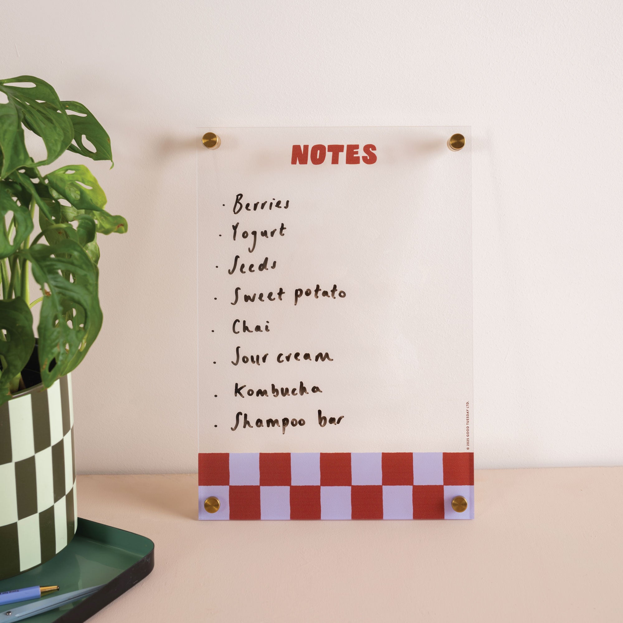 Blueberry check acrylic notepad styled in workspace for organising notes and ideas