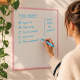 Blue dry wipe pen in use on a whiteboard. 