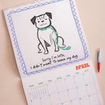 Month to view page of 2027 Dog Life calendar showing large date grid and dog artwork