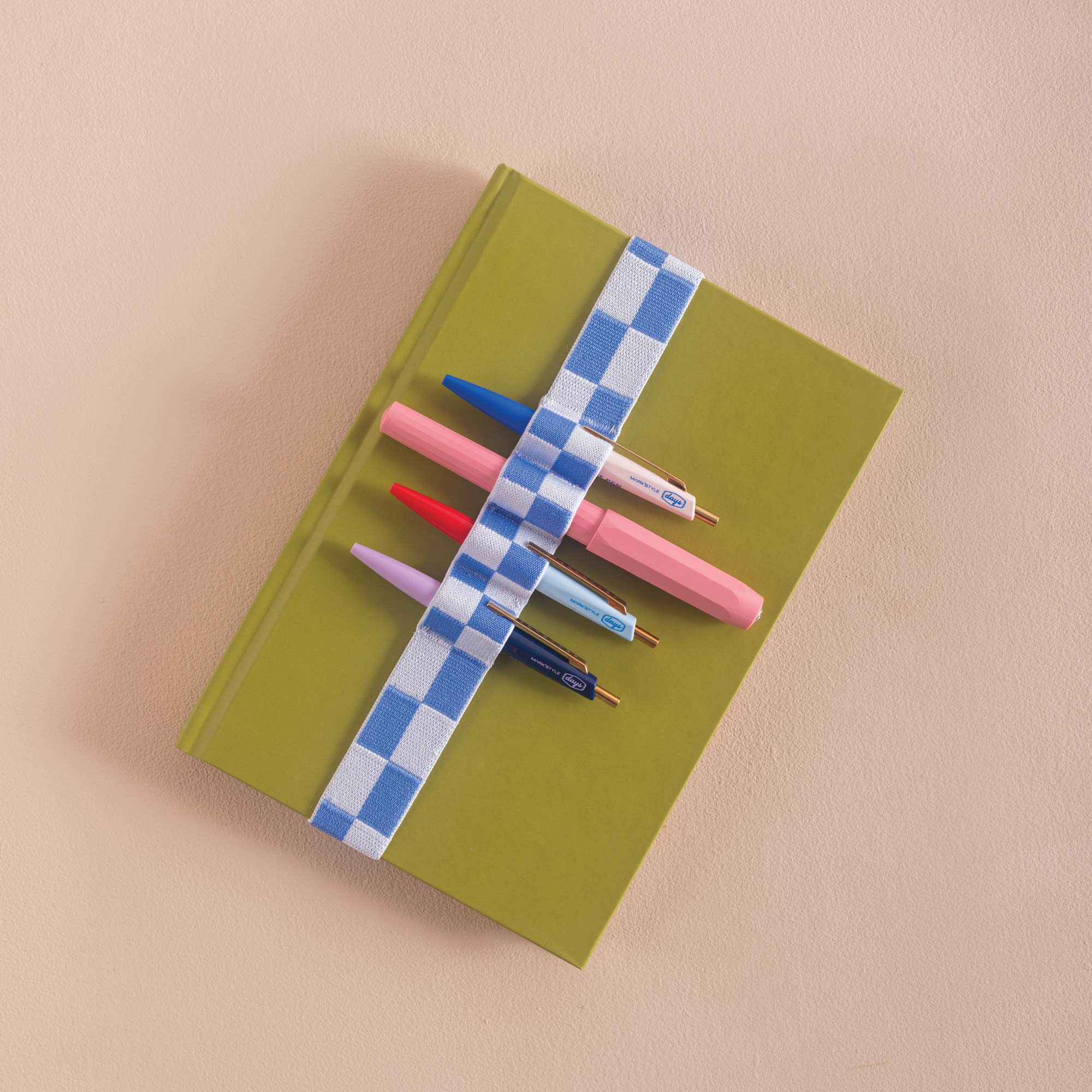 Blue and white checkered bookband, holds 4 pens