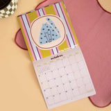 Cat Life wall calendar, month to view grid with playful cat illustrations
