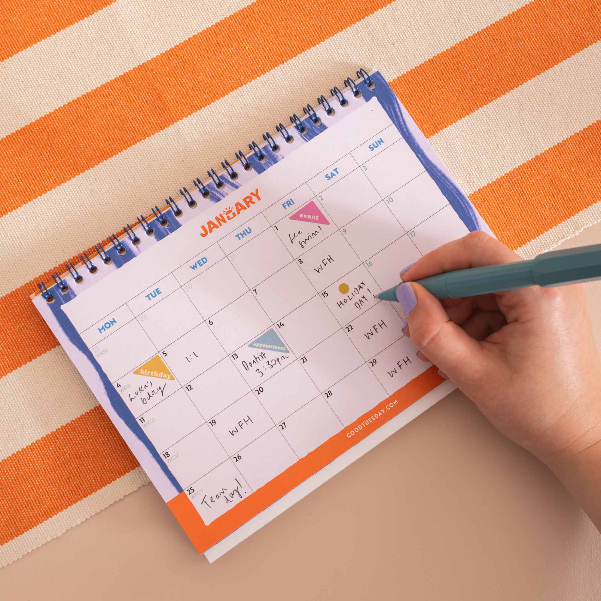 Month-to-view grid layout, week starts Monday with weekends highlighted, Coastal Stripe Desk Calendar