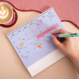Month-to-view grid layout, week starts Monday with weekends highlighted, Colourburst Desk Calendar