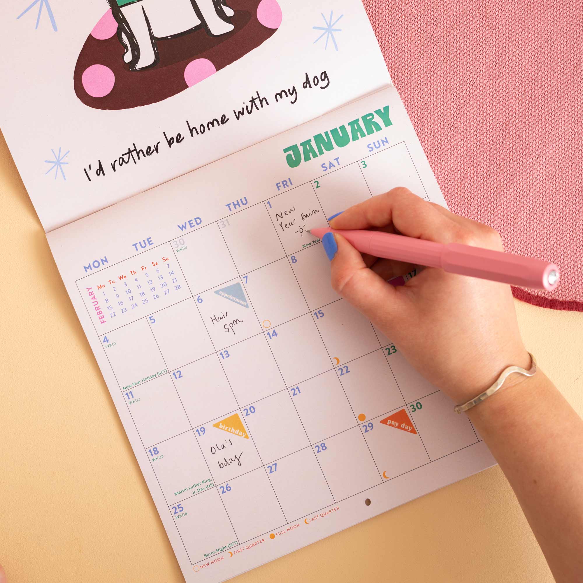 Dog Life wall calendar, month to view grid with dog illustrations