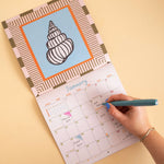 Seashells wall calendar, month to view grid with coastal illustrations