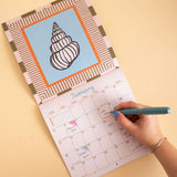 Seashells wall calendar, month to view grid with coastal illustrations