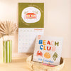 Beach Club Calendar. 2025 large square calendar. Art planner. illustrated calendar. 100% recycled paper. Made in the UK.