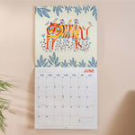 Inside of the Folk Animals 2026 calendar, showing the planner in use. Large monthly grid with week numbers, bank holidays, and lunar phases.