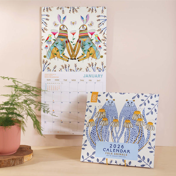 Front cover of 2026 large art calendar - folk art design with whimsical animal illustrations throughout. Printed on 100% recycled paper.