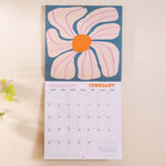 Inside the Les Fleurs 2026 calendar. Large monthly grid with week numbers, bank holidays, and lunar phases.