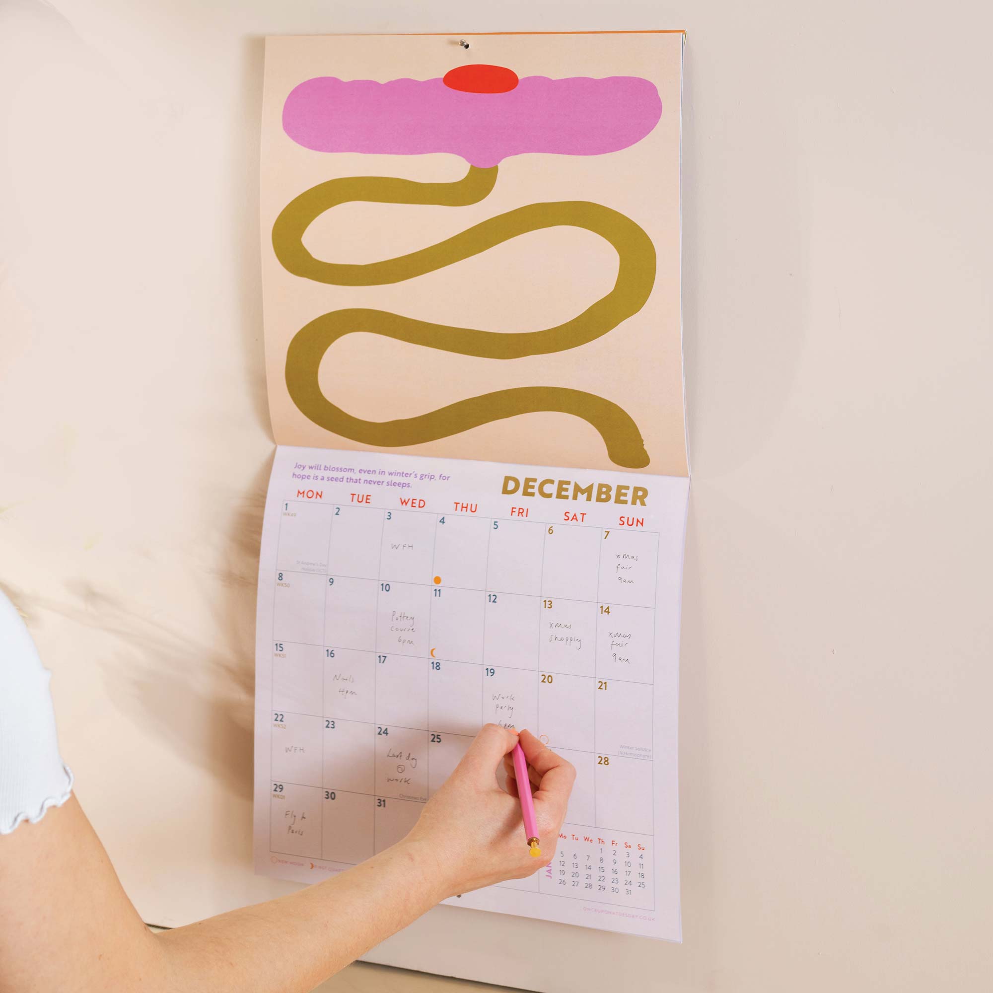 Close up of Les Fleurs 2026 calendar, showing the planner in use. Large monthly grid with week numbers, bank holidays, and lunar phases.