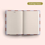 Open 2027 Diary with lined and dotted pages on a pink background.