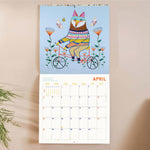 Month to view page of 2027 animal calendar with spacious date grid and playful fox riding a bike illustration