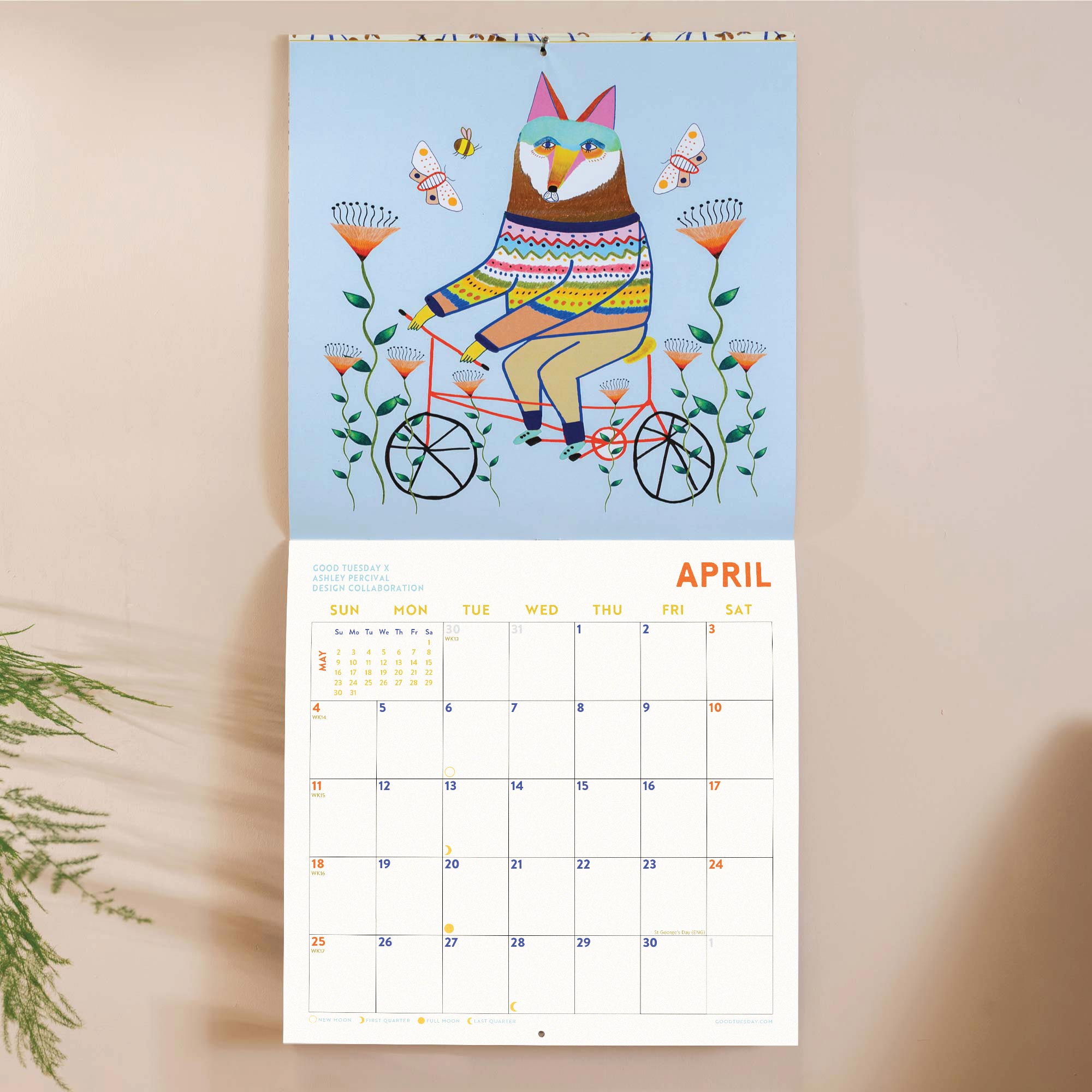 Month to view page of 2027 animal calendar with spacious date grid and playful fox riding a bike illustration