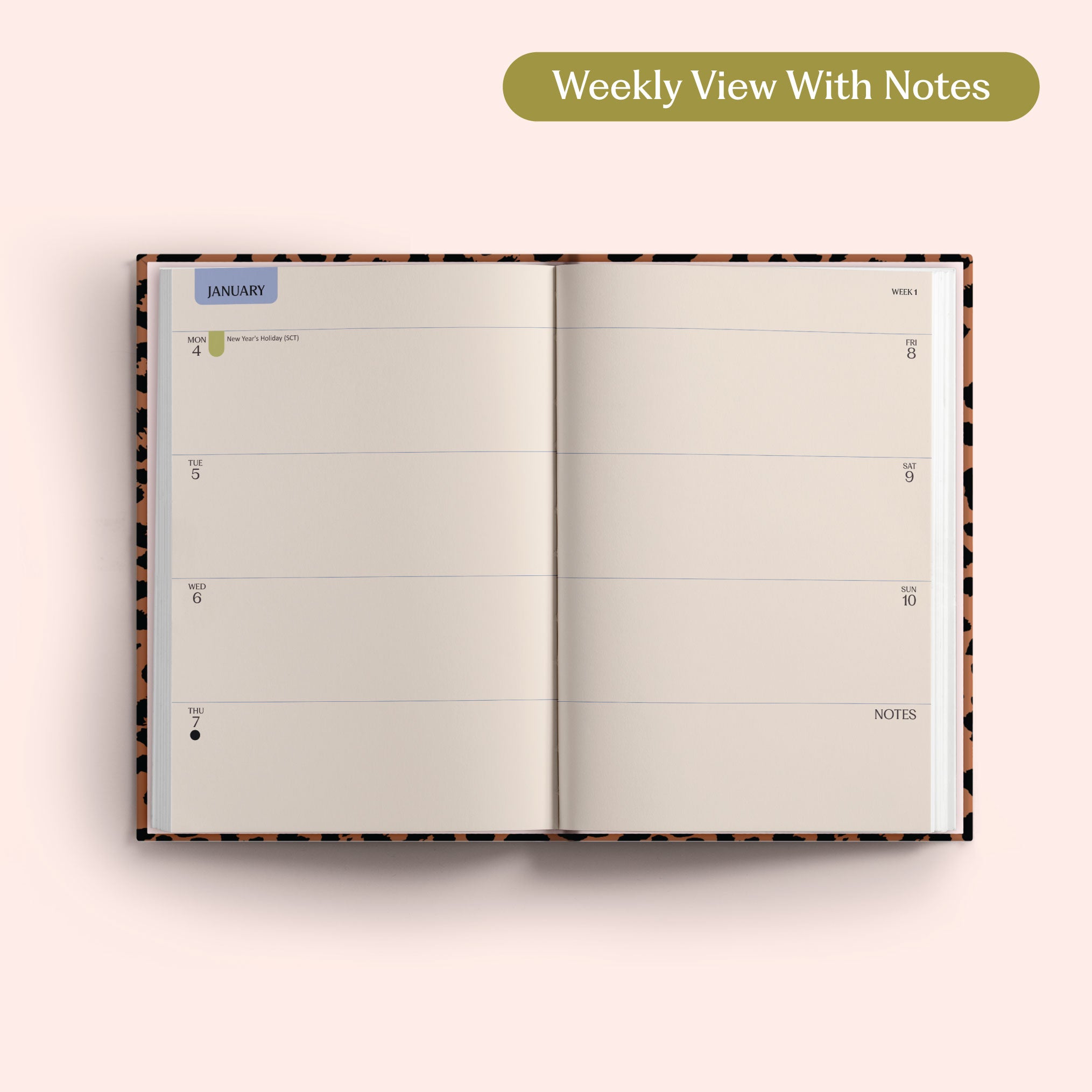 Open planner showing a weekly view with notes on a pink background. Recycled Paper.