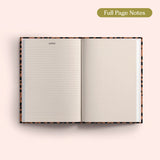 Open 2027 Diary with lined and dotted pages on a pink background.