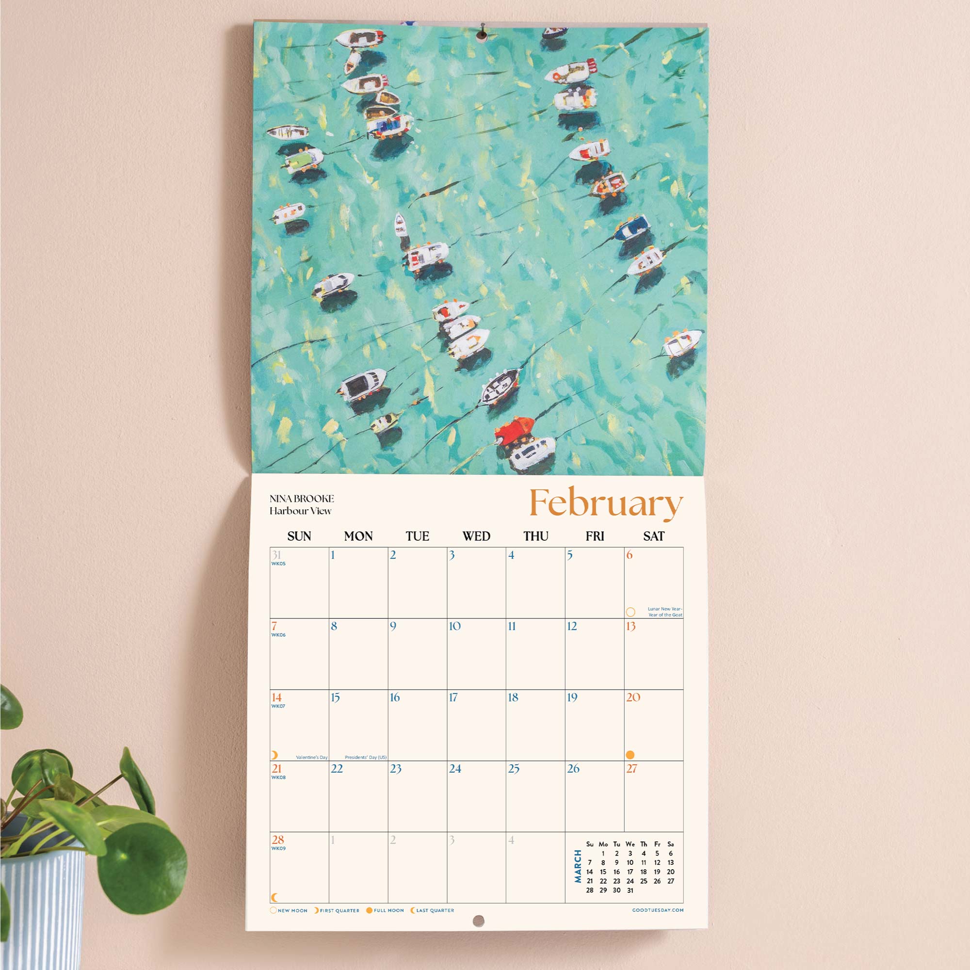Wall calendar showing UK and US holidays notable dates week numbers and moon phases