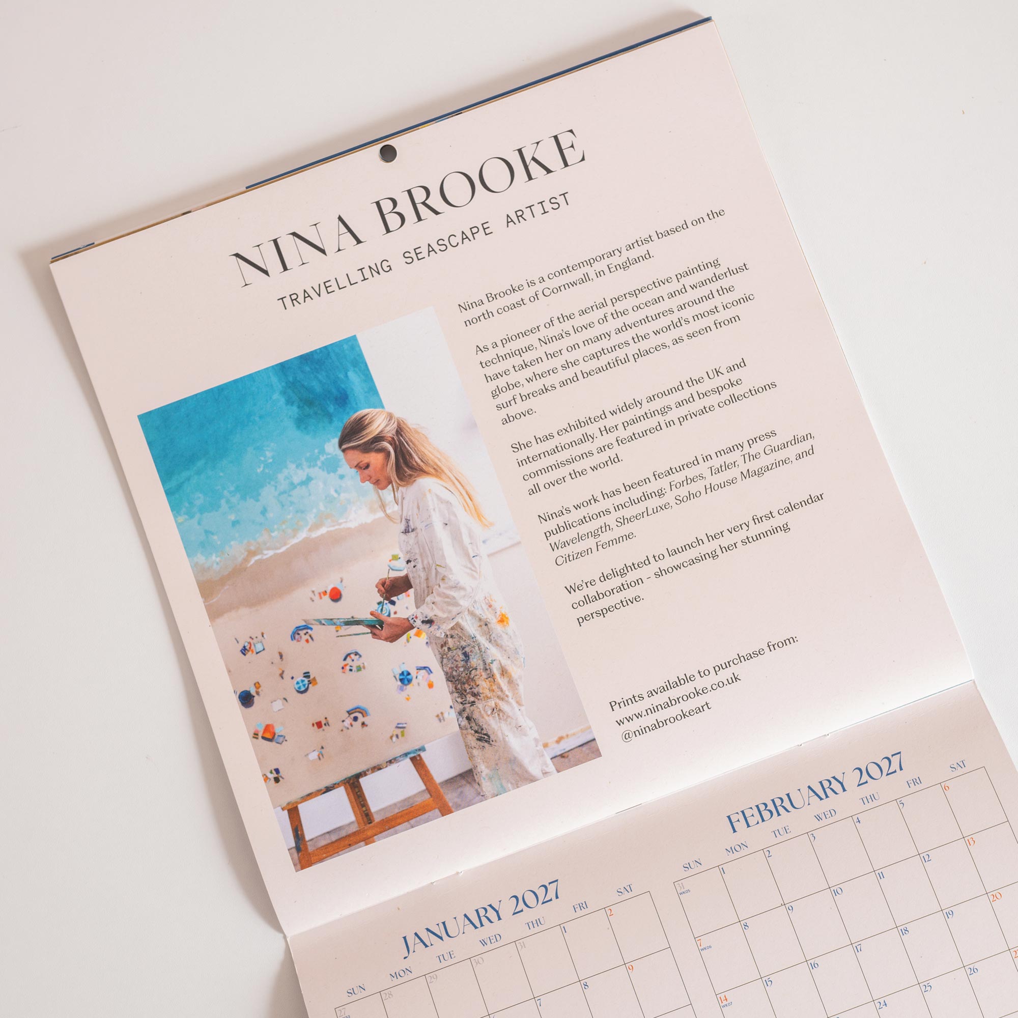 Story page of Nina Brooke and her hand-painted aerial seascape artwork on 2027 wall calendar
