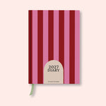 Pink and red stripe weekly 2027 diary with on a pink background. B Corp. Recycled paper.
