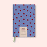 Purple Polka weekly 2027 diary with on a pink background. B Corp. Recycled paper.