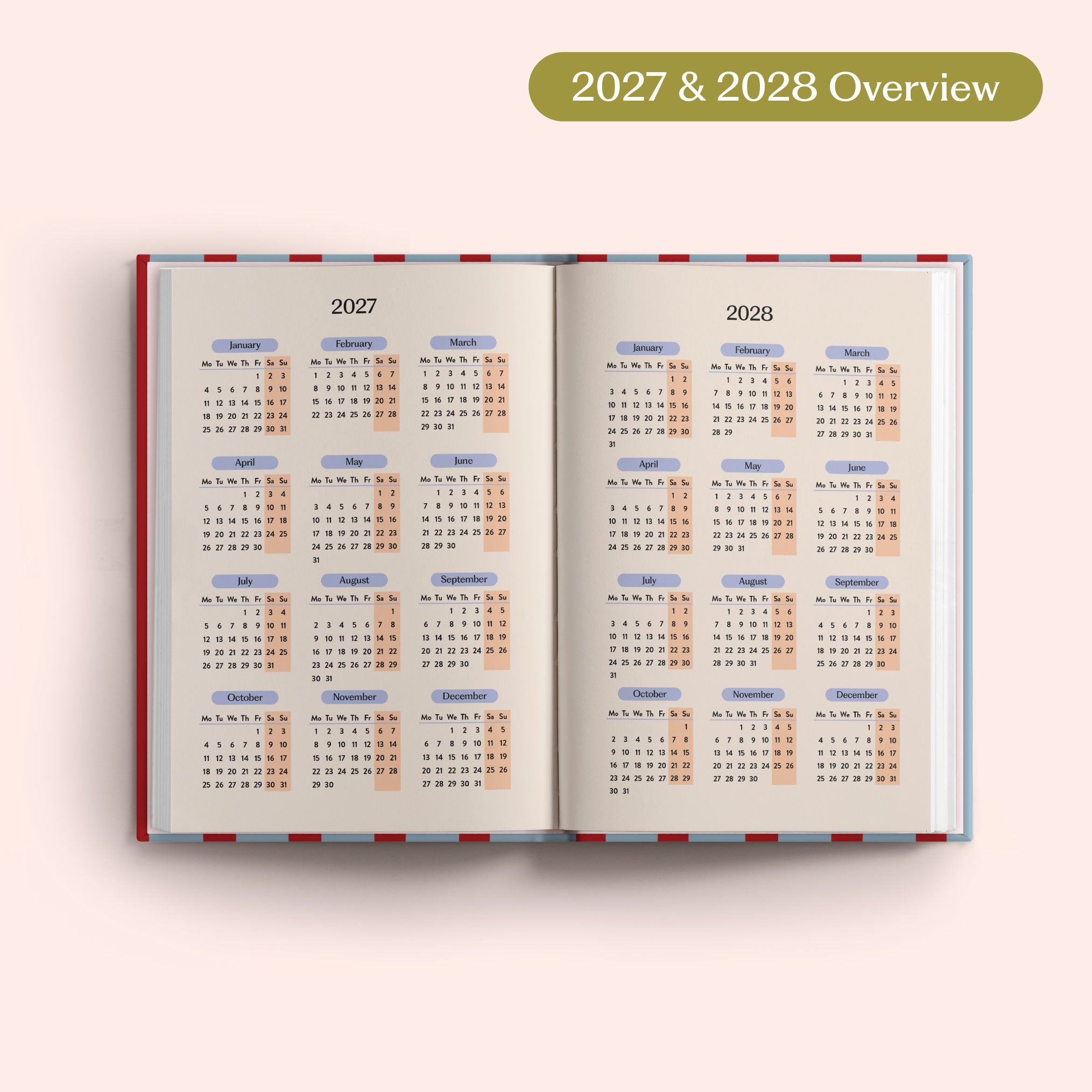 Open planner showing 2027 and 2028 yearly overview on a pink background.