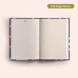 Open 2027 Diary with lined and dotted pages on a pink background.