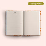 Open 2027 Diary with lined and dotted pages on a pink background.
