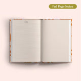 Open 2027 Diary with lined and dotted pages on a pink background.