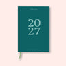 Teal weekly 2027 diary with on a pink background. B Corp. Recycled paper.