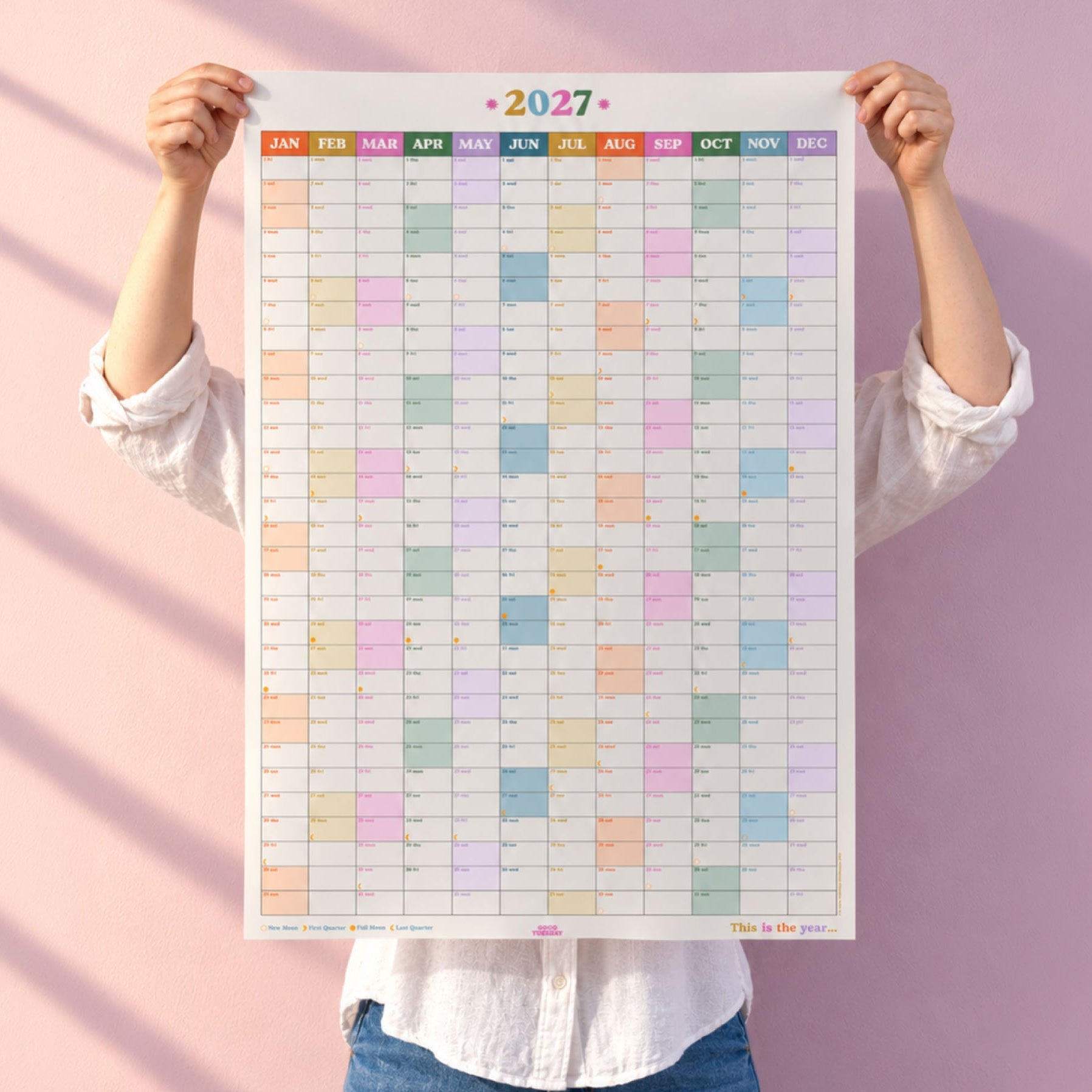 2027 year wall planner calendar in rainbow colours with weekends highlighted and moon phases showing by Good Tuesday