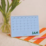 Inner Page of 2027 desk calendar showing the monthly grid layout, made in the UK, 100% recycled paper plastic free packaging in design Colourburst