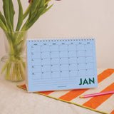 Inner Page of 2027 desk calendar showing the monthly grid layout, made in the UK, 100% recycled paper plastic free packaging in design Colourburst