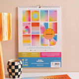 Good Tuesday's 2026 calendar with colorful gradient design. 100% recycled paper.