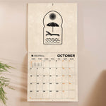 Inside of the Surf Art 2026 calendar. Large monthly grid with week numbers, bank holidays, and lunar phases.