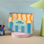 Spiral bound academic desk calendar standing upright with monthly overview