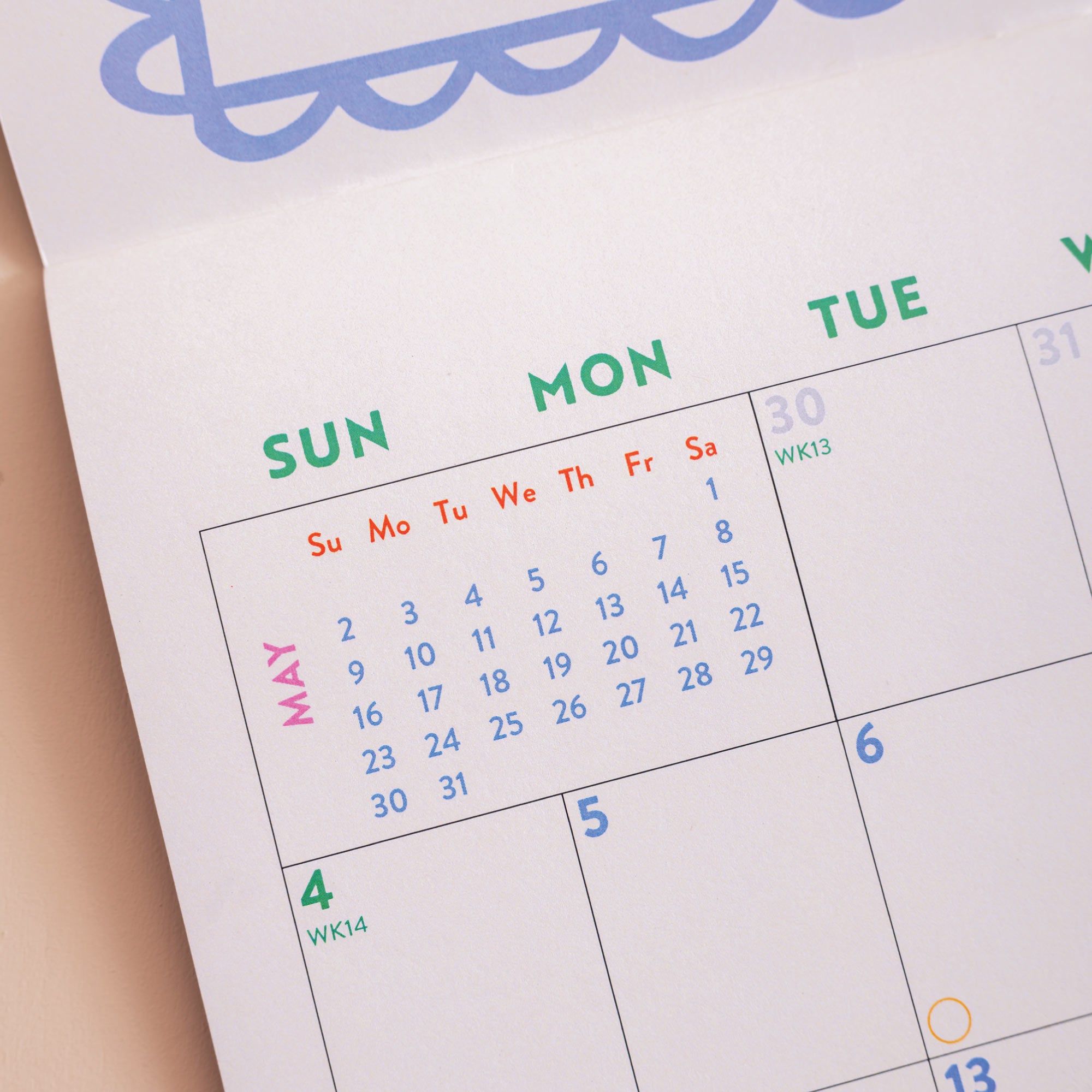 Month to view page of 2027 Dog Life calendar showing large date grid and dog artwork