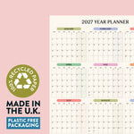2027 Pastel Monthly Grid Wall Planner on recycled paper with 'Made in the U.K.' and 'Plastic Free Packaging' text.