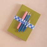 Blue and white checkered bookband, holds 4 pens