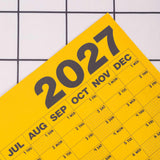 2027 Design Museum Yellow Wall Planner, weekends highlighted, moon phases