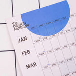 2027 Design Museum Dots & Grids Wall Planner, weekends highlighted, moon phases