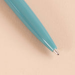 Kikkerland mini retro pens close-up showing the two-tone design