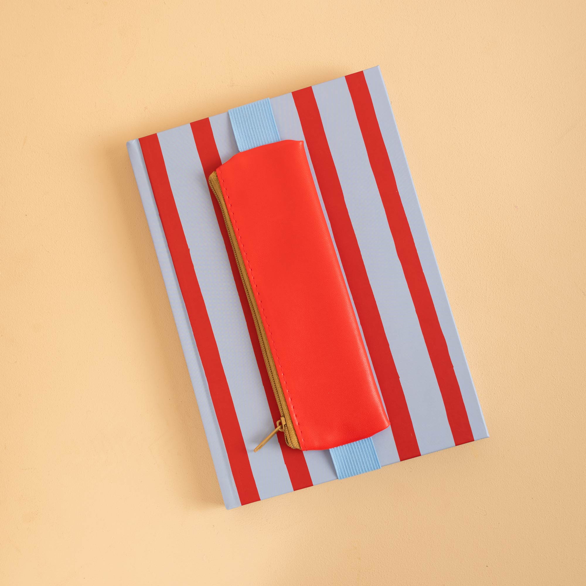 Smooth-running zip with contrast fabric pull tab, Kikkerland pencil pouch in Red