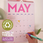 A4 academic calendar with red wire binding and recycled paper pages