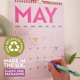 A4 academic calendar with red wire binding and recycled paper pages
