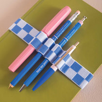 Blue and white checkered bookband, holds 4 pens
