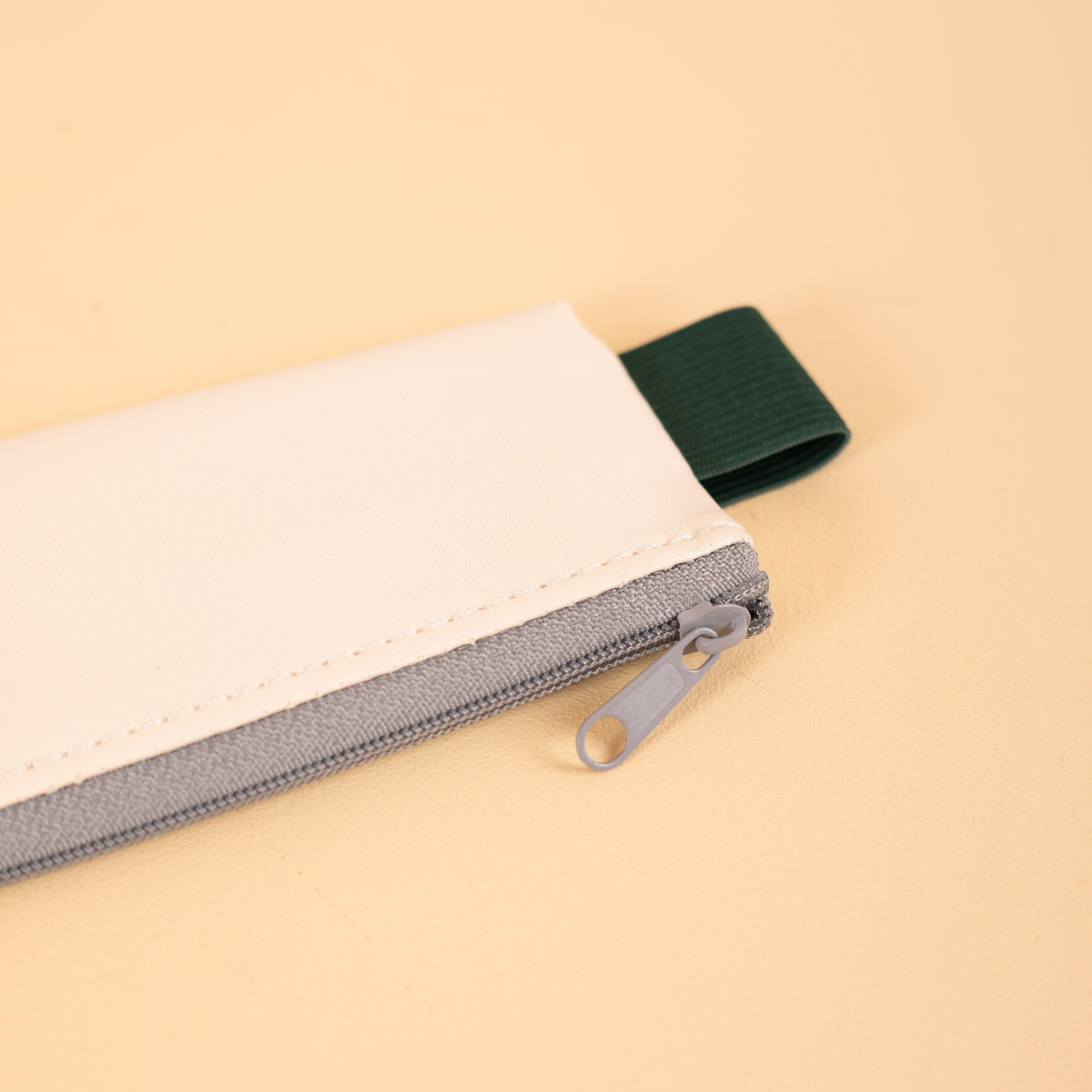 Soft-touch, wipe-clean pencil pouch in Cream, 26.3 x 22cm, by Kikkerland