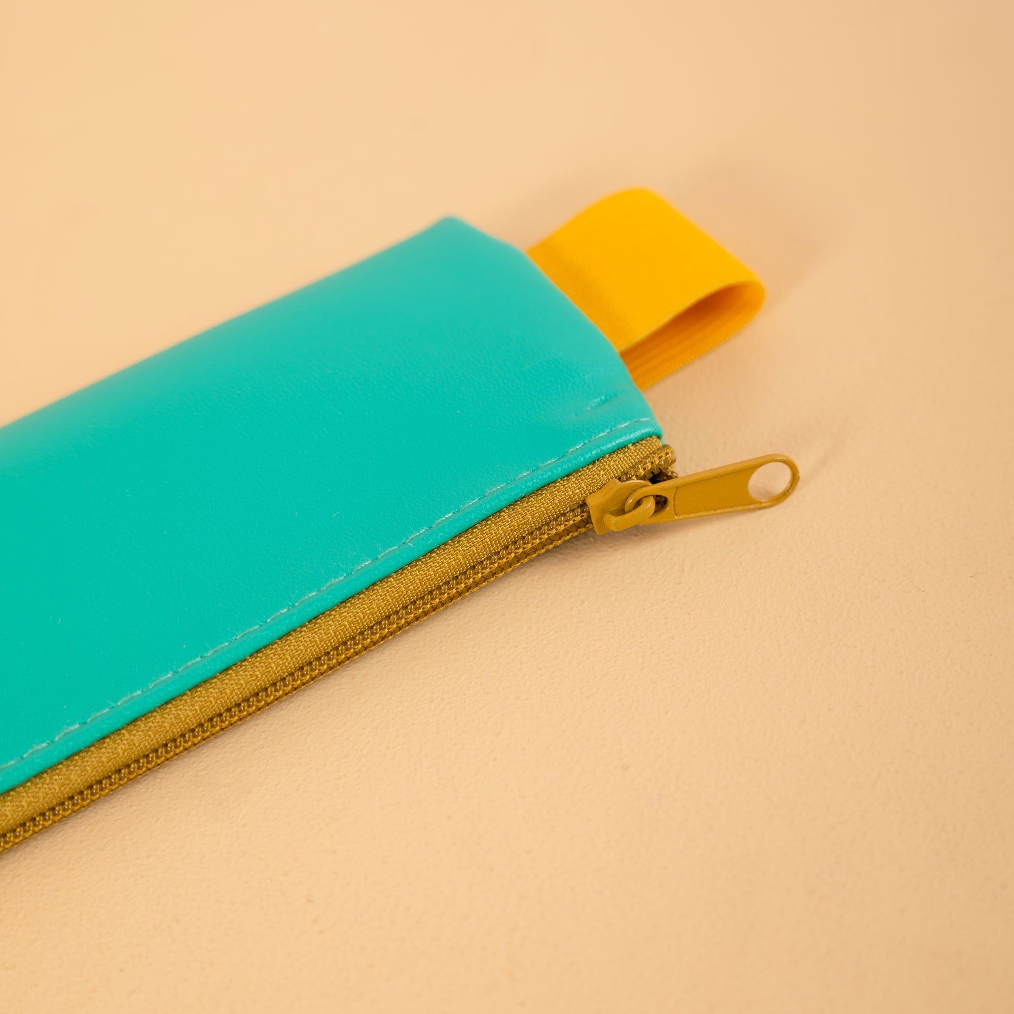 Soft-touch, wipe-clean pencil pouch in Turquoise, 26.3 x 22cm, by Kikkerland