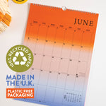 Good Tuesday's 2026 calendar with colorful gradient design. 100% recycled paper. Made in the UK. Plastic free packaging.