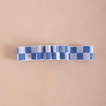 Blue and white checkered bookband, holds 4 pens
