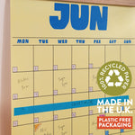 Butter Yellow june planner page with a recycling logo and text about recycled paper and plastic-free packaging.